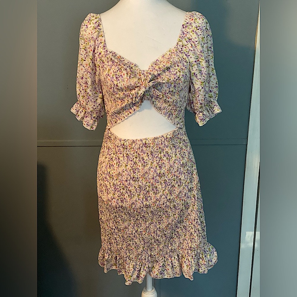 One piece summer dress. Floral pattern with an open front.